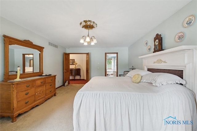 706 Grandview Ct, Elmore, OH 43416 - bedroom with light colored carpet and a chandelier