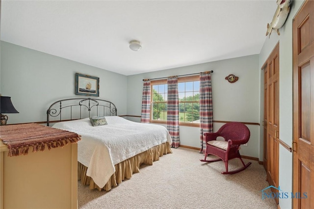 706 Grandview Ct, Elmore, OH 43416 - bedroom featuring light colored carpet and baseboards