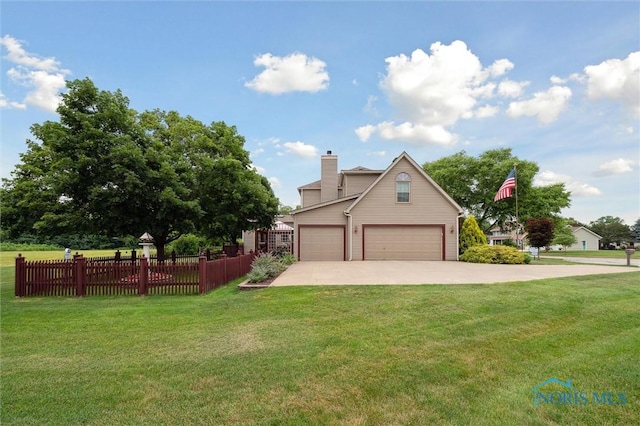 706 Grandview Ct, Elmore, OH 43416 - view of front facade featuring a garage, a chimney, and concrete driveway