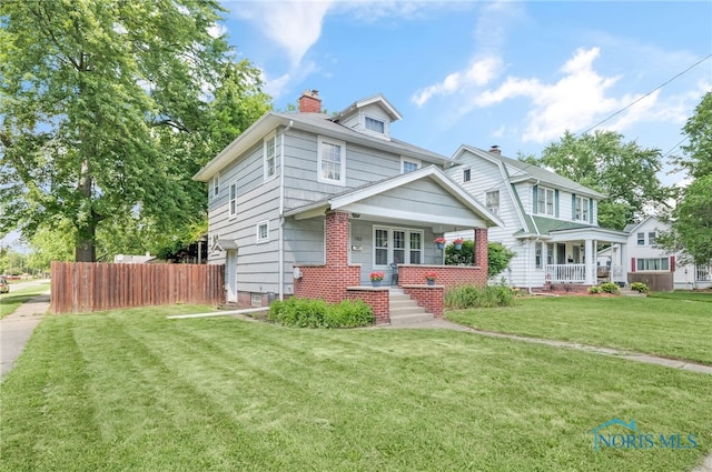 3162 Glanzman Rd, Toledo, OH 43614 - traditional style home featuring covered porch and a chimney