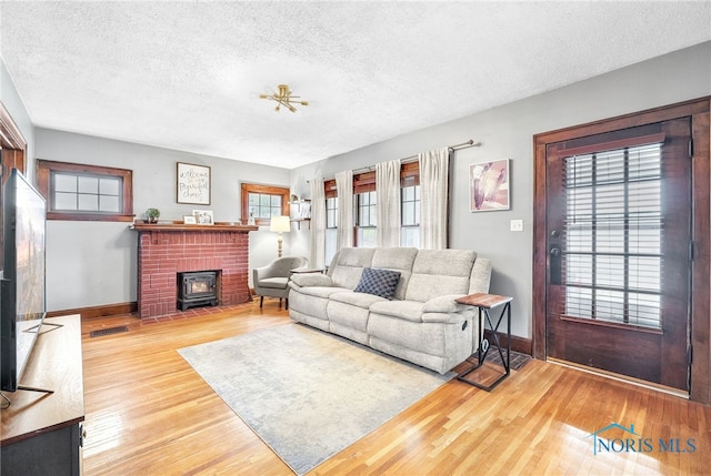 3162 Glanzman Rd, Toledo, OH 43614 - living area featuring a textured ceiling and wood finished floors