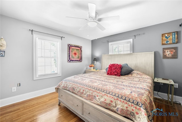 3162 Glanzman Rd, Toledo, OH 43614 - bedroom with wood finished floors and ceiling fan