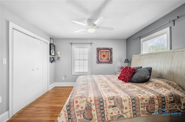 3162 Glanzman Rd, Toledo, OH 43614 - bedroom with wood finished floors, ceiling fan, and a closet