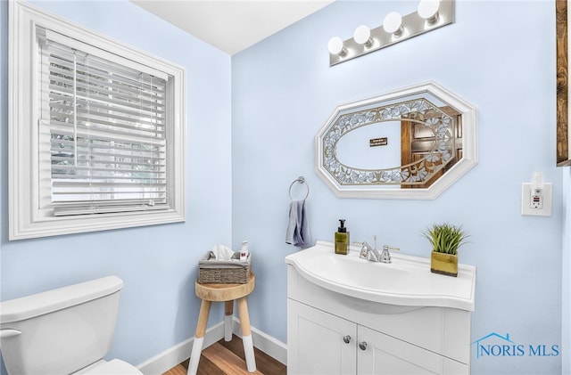 3162 Glanzman Rd, Toledo, OH 43614 - half bath with vanity and wood finished floors