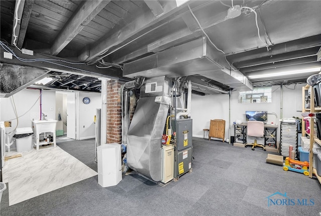 3162 Glanzman Rd, Toledo, OH 43614 - basement with a sink and heating unit