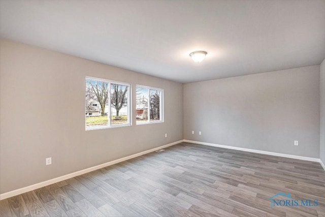 1492 Lee Ann Ave, Defiance, OH 43512 - empty room featuring wood finished floors and baseboards