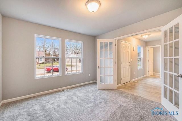 1492 Lee Ann Ave, Defiance, OH 43512 - unfurnished room with french doors and carpet