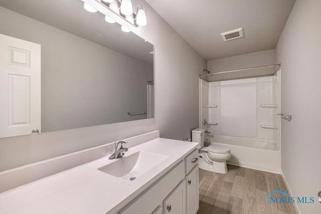 1492 Lee Ann Ave, Defiance, OH 43512 - bathroom featuring vanity, wood finished floors, and washtub / shower combination
