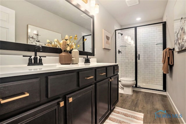 1492 Lee Ann Ave, Defiance, OH 43512 - bathroom with wood finished floors, double vanity, a stall shower, and recessed lighting