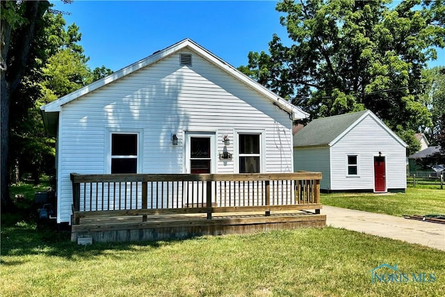 4134 Angola Rd, Toledo, OH 43615 - back of property with a deck and a lawn