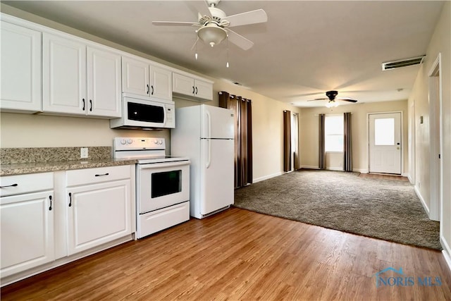 4134 Angola Rd, Toledo, OH 43615 - kitchen featuring white appliances, a ceiling fan, white cabinets, and light wood-type flooring