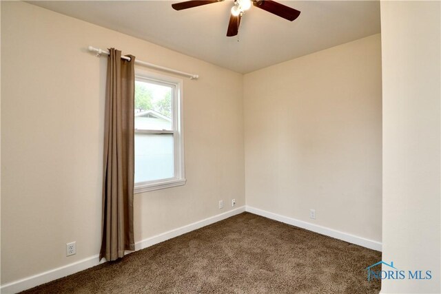 4134 Angola Rd, Toledo, OH 43615 - empty room featuring dark carpet and a ceiling fan