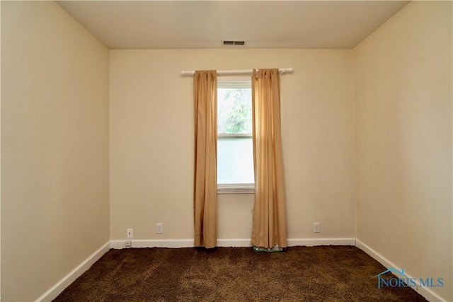 4134 Angola Rd, Toledo, OH 43615 - spare room with dark colored carpet and baseboards