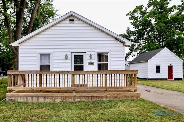 4134 Angola Rd, Toledo, OH 43615 - rear view of property featuring a deck and a lawn
