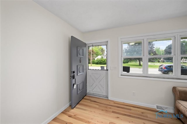 1118 Michigan Ave, Maumee, OH 43537 - foyer entrance with baseboards and light wood finished floors