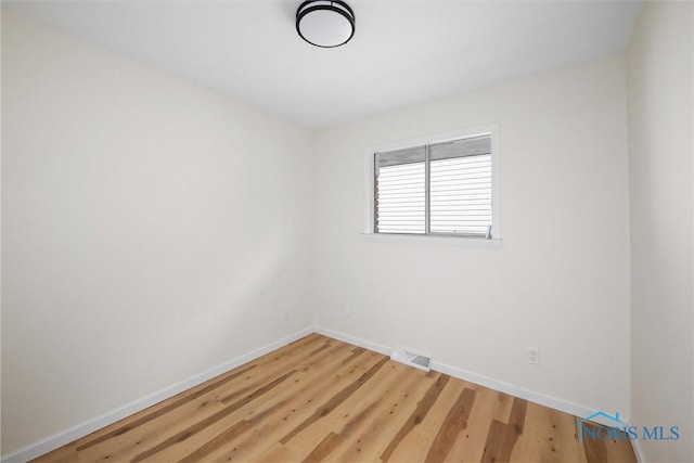 1118 Michigan Ave, Maumee, OH 43537 - empty room with light wood-style floors and baseboards