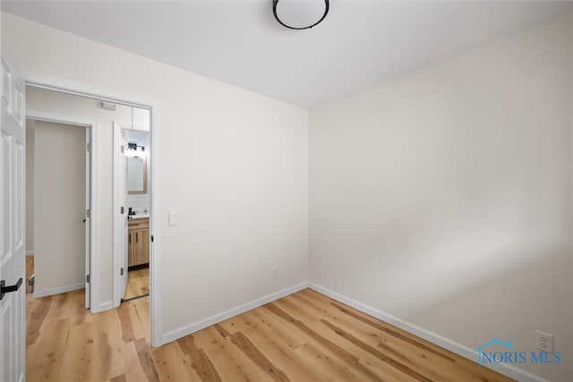 1118 Michigan Ave, Maumee, OH 43537 - spare room featuring light wood finished floors and baseboards