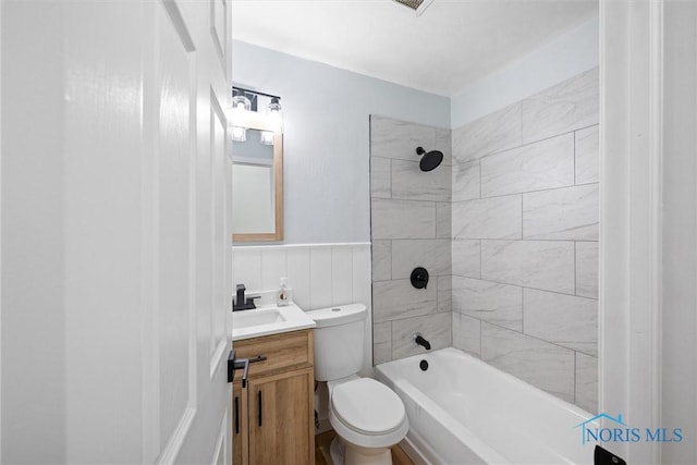 1118 Michigan Ave, Maumee, OH 43537 - bathroom with vanity,  shower combination, and a wainscoted wall