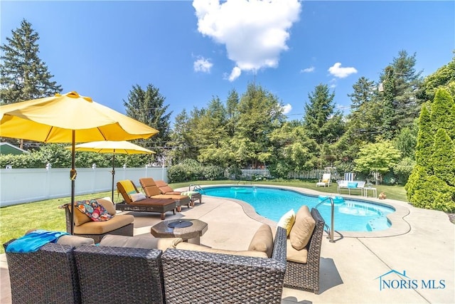 2403 Hempstead Rd, Ottawa Hills, OH 43606 - view of pool with outdoor lounge area, a fenced backyard, a patio, and view of wooded area