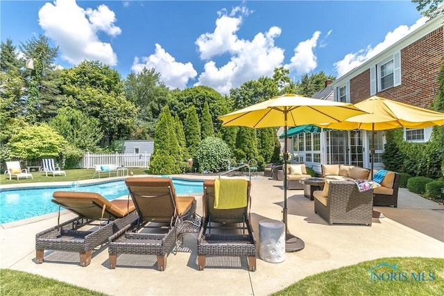2403 Hempstead Rd, Ottawa Hills, OH 43606 - view of swimming pool featuring outdoor lounge area, a patio area, and view of scattered trees