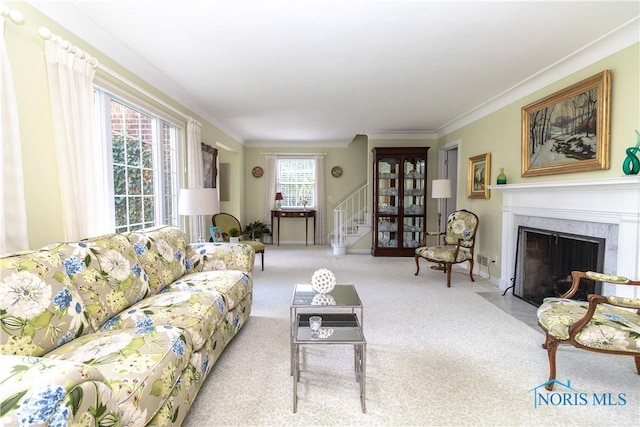 2403 Hempstead Rd, Ottawa Hills, OH 43606 - living area featuring stairway, crown molding, a fireplace, and carpet