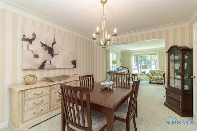 2403 Hempstead Rd, Ottawa Hills, OH 43606 - dining space with wallpapered walls, a chandelier, crown molding, and light colored carpet