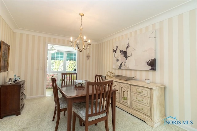 2403 Hempstead Rd, Ottawa Hills, OH 43606 - dining area featuring a chandelier, light colored carpet, crown molding, and wallpapered walls