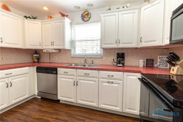 2403 Hempstead Rd, Ottawa Hills, OH 43606 - kitchen with appliances with stainless steel finishes, white cabinets, butcher block counters, recessed lighting, and decorative backsplash