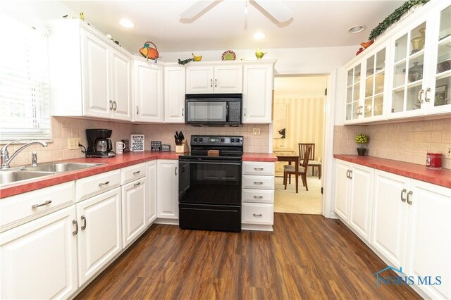 2403 Hempstead Rd, Ottawa Hills, OH 43606 - kitchen featuring black appliances, ceiling fan, dark wood finished floors, white cabinets, and backsplash