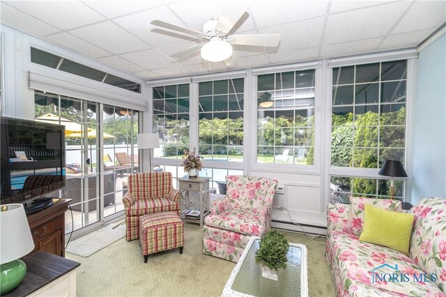 2403 Hempstead Rd, Ottawa Hills, OH 43606 - sunroom / solarium with ceiling fan, carpet flooring, a baseboard heating unit, and a paneled ceiling