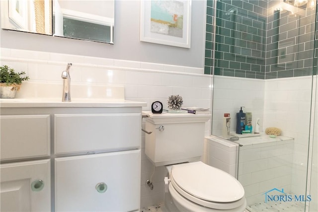 2403 Hempstead Rd, Ottawa Hills, OH 43606 - bathroom with tile walls, a stall shower, vanity, and a wainscoted wall
