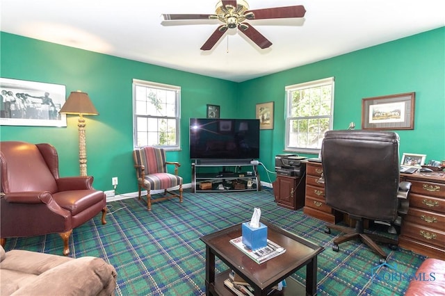2403 Hempstead Rd, Ottawa Hills, OH 43606 - living area with healthy amount of natural light, dark colored carpet, a ceiling fan, and an office area