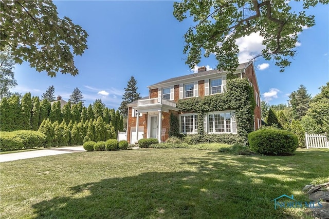 2403 Hempstead Rd, Ottawa Hills, OH 43606 - view of front facade with brick siding, a balcony, and a chimney