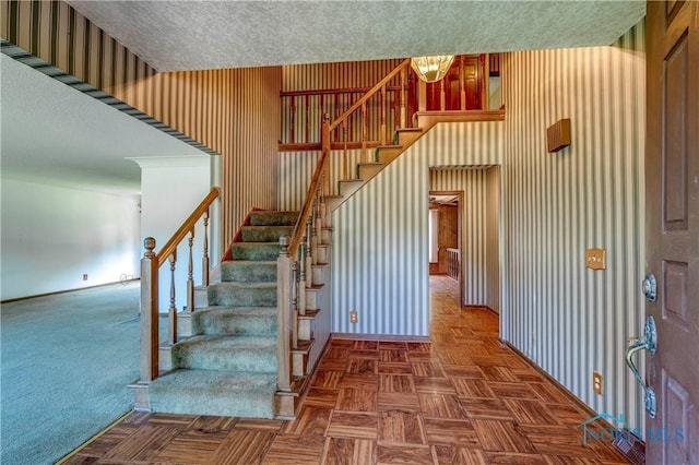6608 Inglewood Dr, Holland, OH 43528 - stairway with baseboards and a textured ceiling