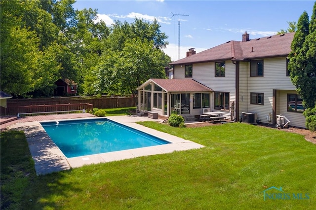 6608 Inglewood Dr, Holland, OH 43528 - view of swimming pool featuring a sunroom, a fenced backyard, and a patio area