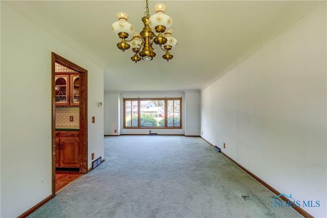 6608 Inglewood Dr, Holland, OH 43528 - unfurnished living room featuring carpet floors and a chandelier