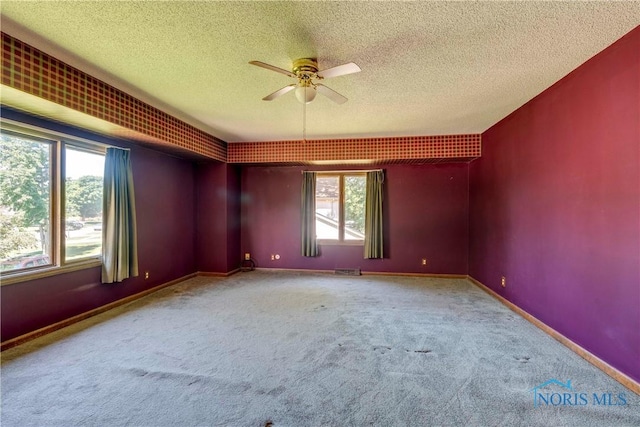 6608 Inglewood Dr, Holland, OH 43528 - unfurnished room featuring a textured ceiling, carpet, and ceiling fan