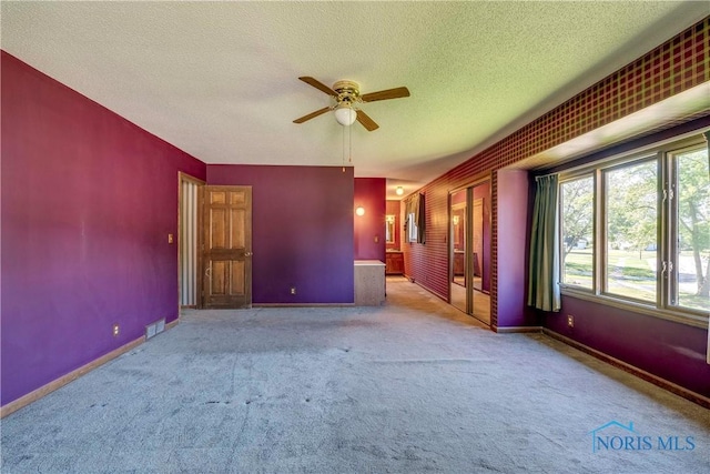 6608 Inglewood Dr, Holland, OH 43528 - spare room with carpet, a ceiling fan, and a textured ceiling