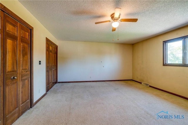 6608 Inglewood Dr, Holland, OH 43528 - empty room with light colored carpet, a textured ceiling, and ceiling fan