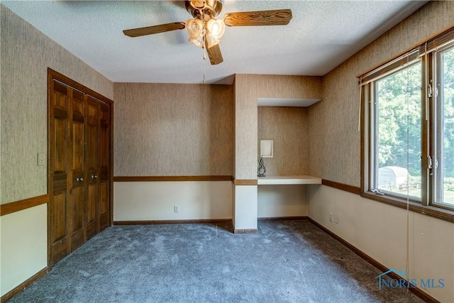 6608 Inglewood Dr, Holland, OH 43528 - spare room featuring plenty of natural light, a textured ceiling, ceiling fan, and carpet flooring