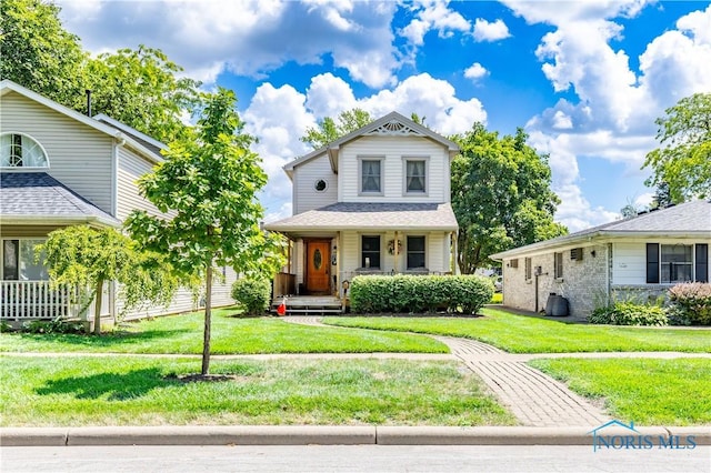 312 W Dudley St, Maumee, OH 43537 - view of front of house with covered porch and a front yard