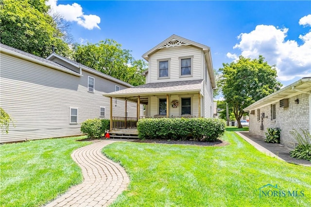 312 W Dudley St, Maumee, OH 43537 - victorian home featuring a front lawn and a porch