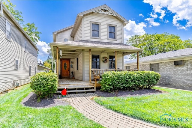 312 W Dudley St, Maumee, OH 43537 - view of front facade featuring a front lawn and a porch