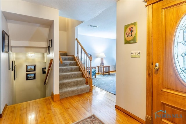 312 W Dudley St, Maumee, OH 43537 - foyer entrance with light wood-style floors and stairs