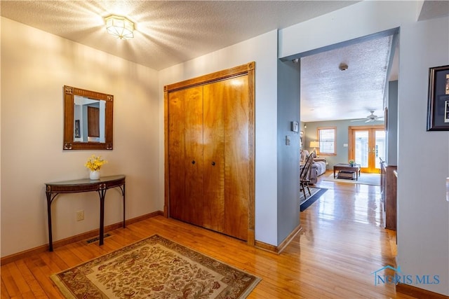312 W Dudley St, Maumee, OH 43537 - entryway with a textured ceiling and light wood-style flooring
