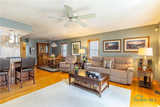 312 W Dudley St, Maumee, OH 43537 - living area featuring light wood-type flooring and a ceiling fan
