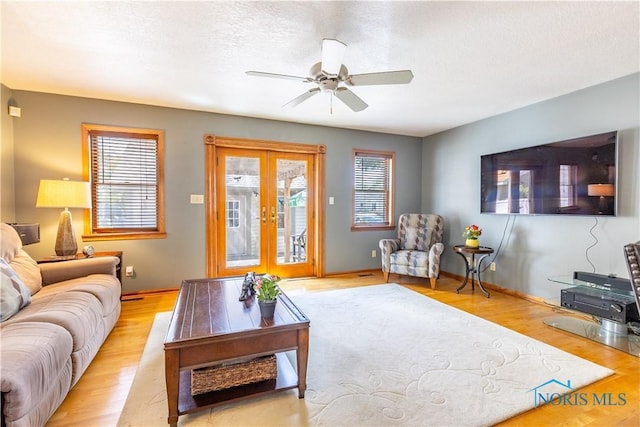 312 W Dudley St, Maumee, OH 43537 - living room featuring french doors, a ceiling fan, and light wood-style floors