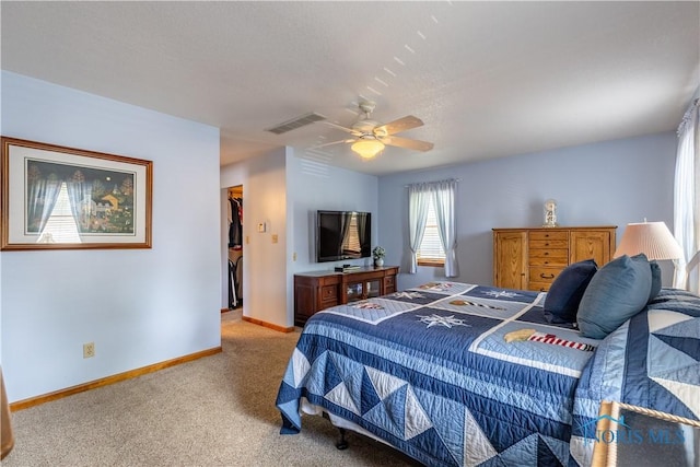 312 W Dudley St, Maumee, OH 43537 - bedroom featuring light carpet, a spacious closet, a ceiling fan, and a closet