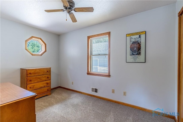 312 W Dudley St, Maumee, OH 43537 - unfurnished bedroom with light carpet and ceiling fan