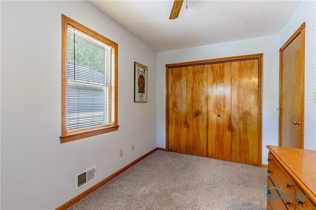 312 W Dudley St, Maumee, OH 43537 - unfurnished bedroom with a closet, carpet, and ceiling fan